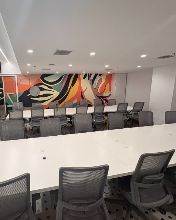 Briefing room seating facing the mural wall used for reviews and management drills