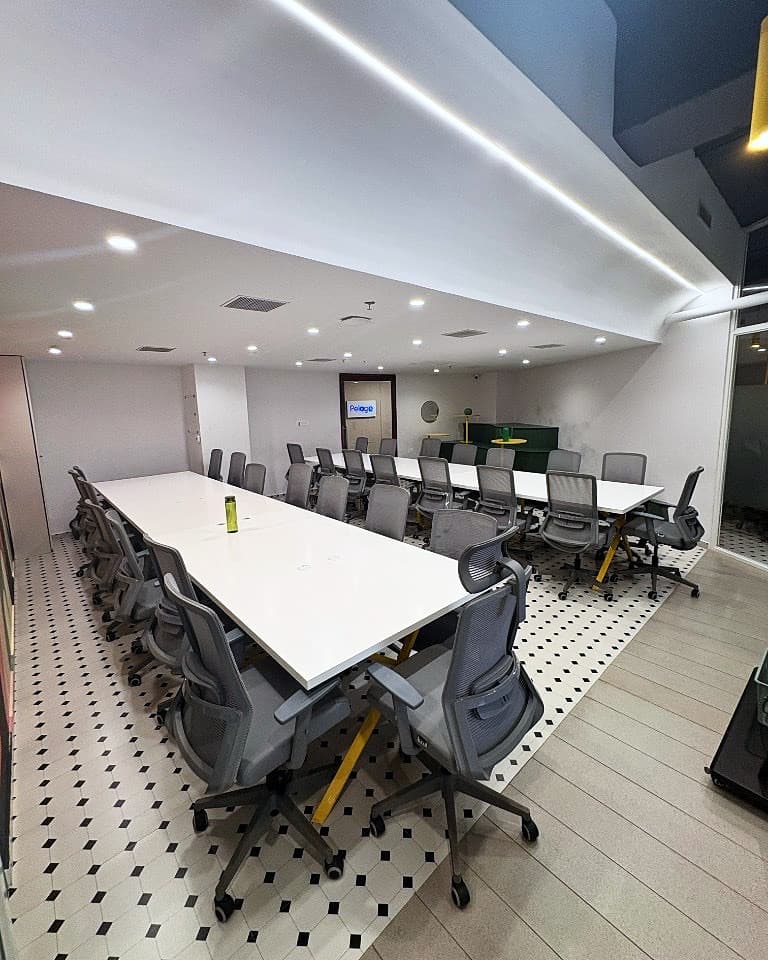 Secondary Corrivex meeting bay with long white tables set for collaborative training